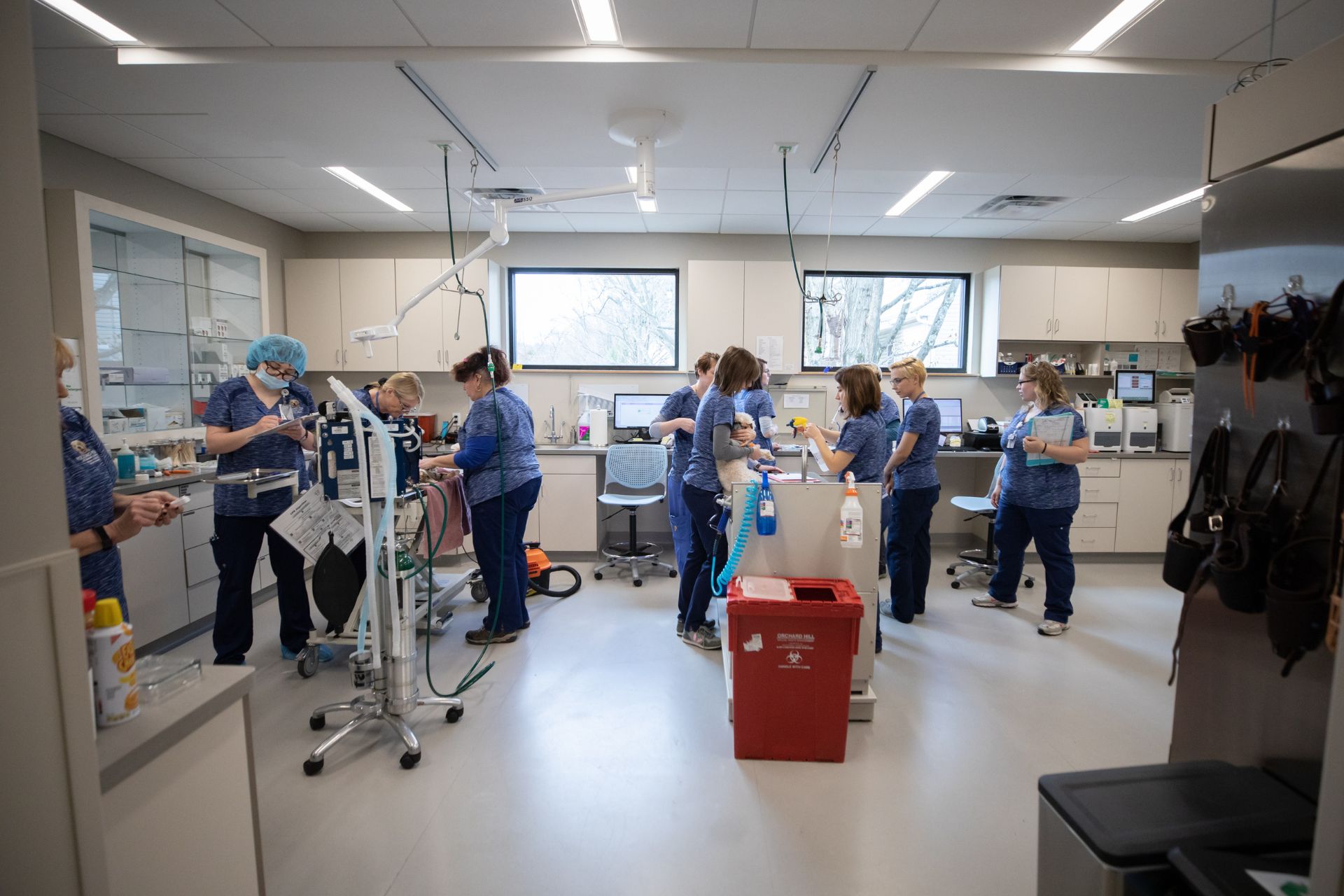 a group of people in blue scrubs in a room